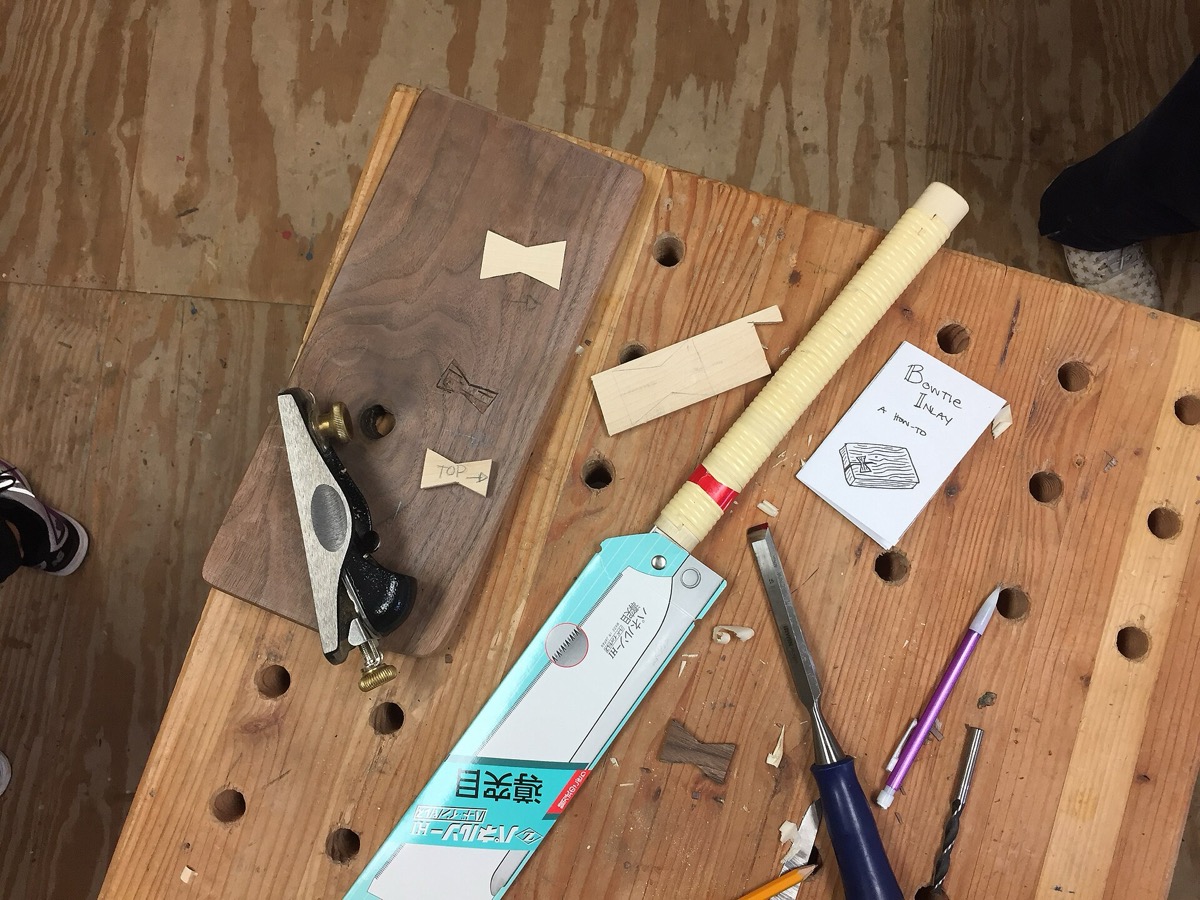 A cabinetmaker's workbench with hand tools